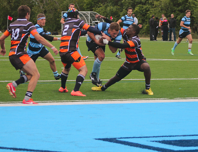 Darren Prong tackles through Mohawk defenders to score the first try of the match 