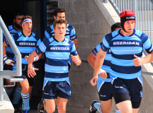 Keith Emmerson leads the Bruins rugby team out onto the field for homecoming 