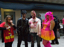Art Fundamentals group holding a fundraiser in the B wing. 
From left: Dannielle harmon, 18, is dressed as Robin, 
18-year-old Kevin McMorran II is from the Eveil Dead, 
Aaron Smith, 19, is a zombie. 
and Julia Scalise, 18, is the Monster of Mischief. 
