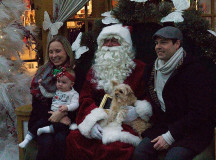 Allie and Brad Malvern visit Santa with their 10-month-old Stevie and five-year-old pom-a-poo Muffin. 