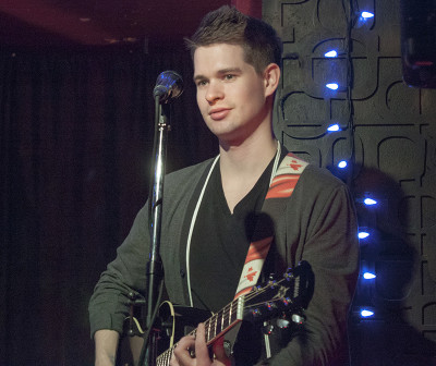 Ross Burant, LUXA’s lead guitarist, performing at the Central Bar in Toronto.