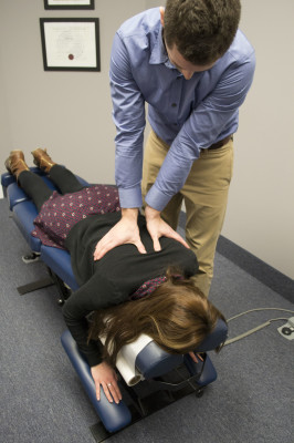 Dr. Justin Guy performs chiropractic work.