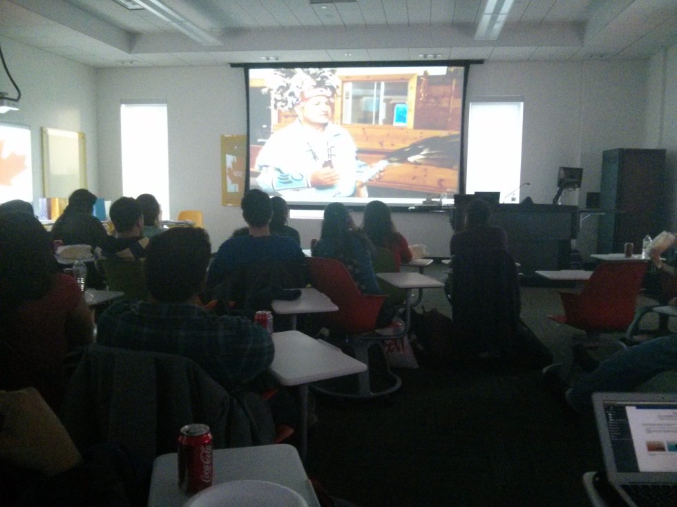 Students watching the movie, Canada, A Diverse Culture at movie night event by SISA. 