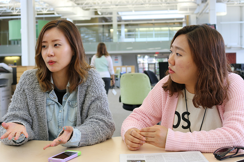 MIje Lee, 24 and Shinhee Kang, 20, participating in a conversation circle