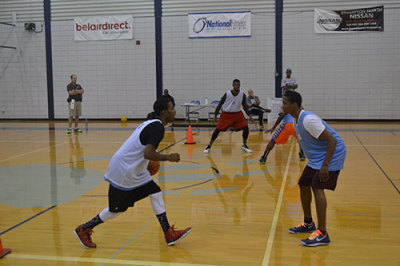 Jamal Pryce (right) plays defence against Timoe Lewis (left).
