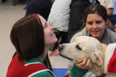 First-year Child and Youth Worker Student Kathleen Glenn recieves kisses from Bailey,8.