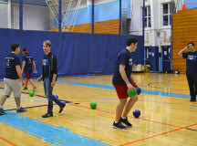 Students join the Sheridan Student Union for a fun game of kings court dodge ball inside the gym.  