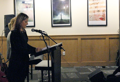 Jennifer Chambers, Creative Writing professor at Sheridan, reciting some of her poetry. She felt more comfortable with it as others got up and performed. Photo by Miranda Newman. 