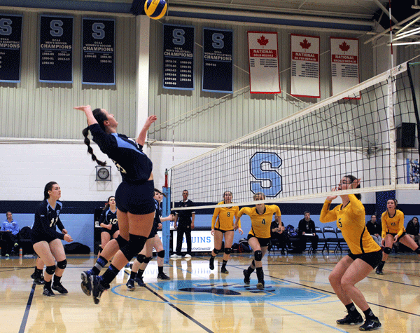 Bruins' Dimitra Stathakos, up at the net, posted 20 kills and 22 digs this weekend in back-to-back wins against Boréal and Cambrian College. 