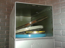 Reel to reel films stored in a cabinet. 