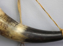 A horn that reads "liberty or death"